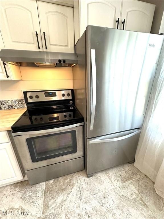 4235 Patricia Ave, Austintown, OH 44511 - kitchen with appliances with stainless steel finishes, under cabinet range hood, white cabinetry, and butcher block counters