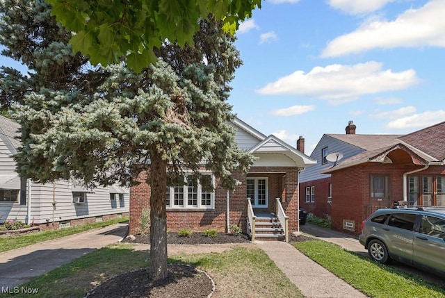 5902 Vandalia Ave, Cleveland, OH 44144 - view of front of house featuring covered porch and brick siding