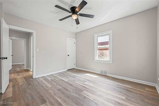 5902 Vandalia Ave, Cleveland, OH 44144 - unfurnished bedroom featuring wood finished floors and ceiling fan
