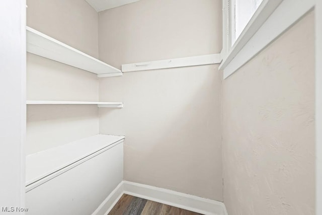 5902 Vandalia Ave, Cleveland, OH 44144 - spacious closet featuring dark wood finished floors