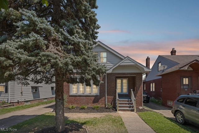 5902 Vandalia Ave, Cleveland, OH 44144 - view of front of home featuring brick siding and french doors