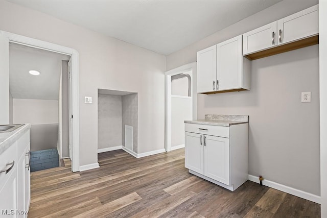 5902 Vandalia Ave, Cleveland, OH 44144 - kitchen featuring white cabinets, light countertops, and wood finished floors