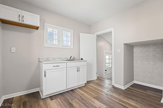 5902 Vandalia Ave, Cleveland, OH 44144 - kitchen featuring wood finished floors, white cabinetry, and light countertops