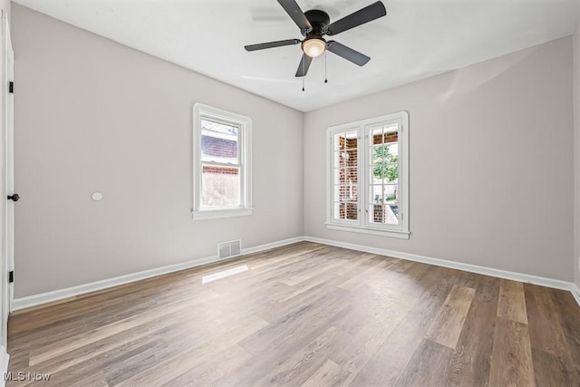 5902 Vandalia Ave, Cleveland, OH 44144 - spare room featuring wood finished floors and a ceiling fan