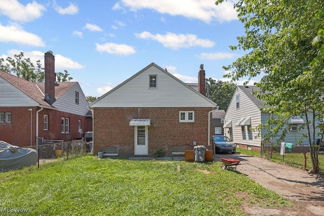5902 Vandalia Ave, Cleveland, OH 44144 - back of property with brick siding and concrete driveway