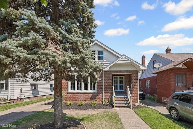 5902 Vandalia Ave, Cleveland, OH 44144 - view of front of property featuring brick siding and covered porch