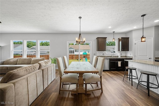 13176 Barrington Dr, Grafton, OH 44044 - dining area featuring dark wood-type flooring, recessed lighting, a chandelier, and a textured ceiling