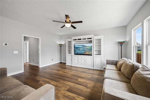 13176 Barrington Dr, Grafton, OH 44044 - living area featuring ceiling fan and dark wood-style flooring