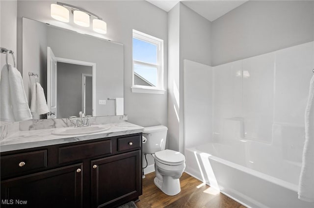 13176 Barrington Dr, Grafton, OH 44044 - bathroom with wood finished floors, vanity, and shower / bathtub combination