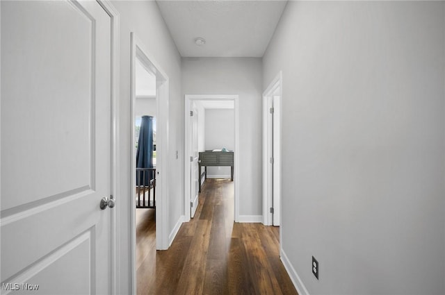 13176 Barrington Dr, Grafton, OH 44044 - hallway with dark wood-type flooring and baseboards