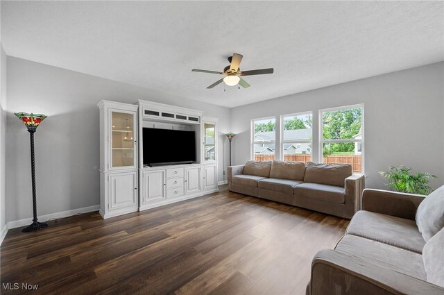 13176 Barrington Dr, Grafton, OH 44044 - living room featuring a ceiling fan and dark wood-style flooring
