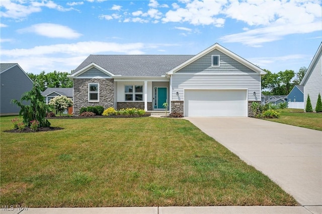 13176 Barrington Dr, Grafton, OH 44044 - view of front of home with stone siding, an attached garage, driveway, and a front lawn