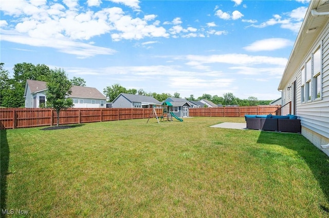 13176 Barrington Dr, Grafton, OH 44044 - fenced backyard featuring a playground, an outdoor hangout area, and a patio