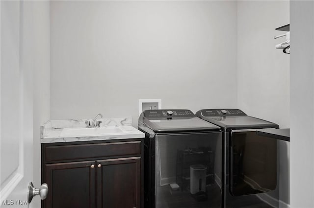 13176 Barrington Dr, Grafton, OH 44044 - laundry area featuring independent washer and dryer and cabinet space