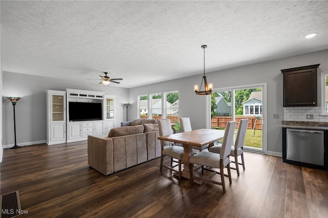 13176 Barrington Dr, Grafton, OH 44044 - dining room with dark wood finished floors, a textured ceiling, a chandelier, a ceiling fan, and recessed lighting