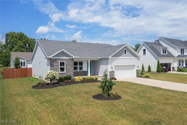 13176 Barrington Dr, Grafton, OH 44044 - view of front of house featuring stone siding, concrete driveway, and an attached garage