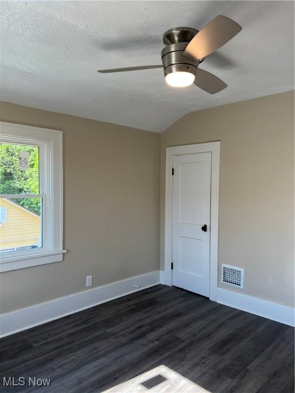 1820 E 47th St, Ashtabula, OH 44004 - empty room with ceiling fan and dark wood-type flooring