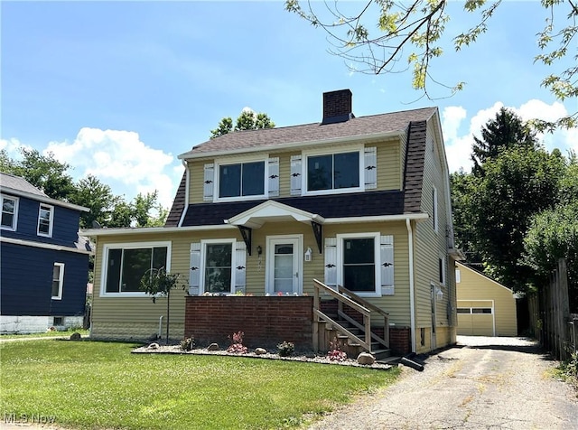 1820 E 47th St, Ashtabula, OH 44004 - dutch colonial with a chimney, an outbuilding, a garage, and a shingled roof