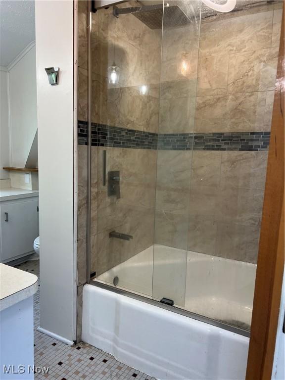 1820 E 47th St, Ashtabula, OH 44004 - full bath featuring enclosed tub / shower combo, vanity, and tile patterned flooring
