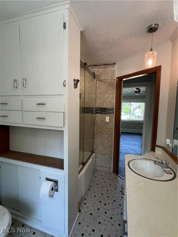 1820 E 47th St, Ashtabula, OH 44004 - bathroom featuring vanity, enclosed tub / shower combo, and a textured ceiling