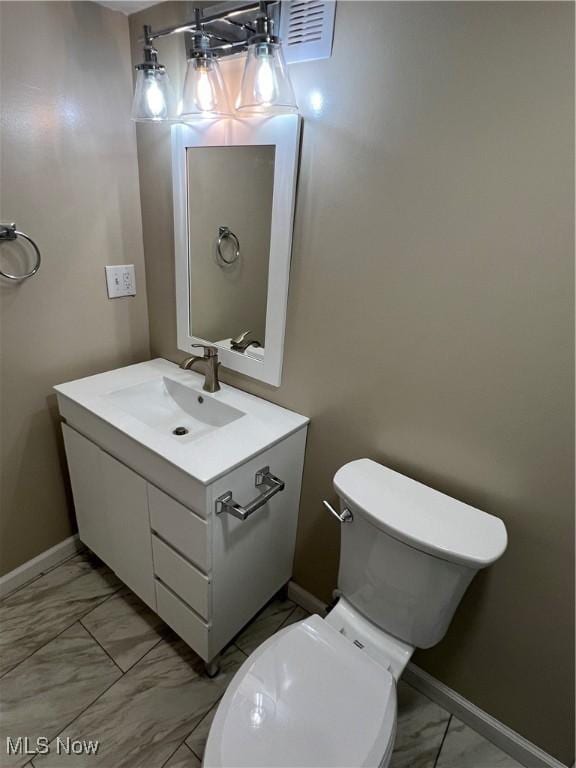 1820 E 47th St, Ashtabula, OH 44004 - bathroom featuring marble look tiles and vanity
