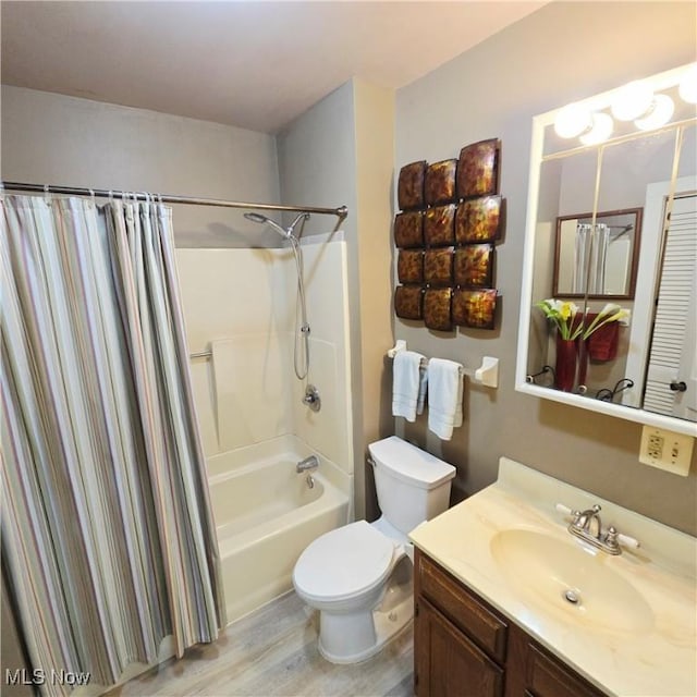 3303 Hemlock St, Parkersburg, WV 26101 - bathroom featuring vanity, shower / bathtub combination with curtain, and wood finished floors