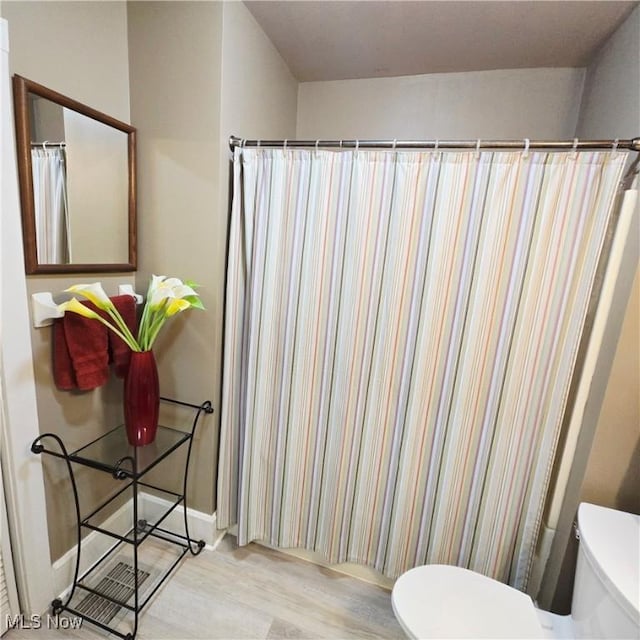 3303 Hemlock St, Parkersburg, WV 26101 - bathroom with wood finished floors and a shower with curtain