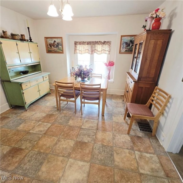 3303 Hemlock St, Parkersburg, WV 26101 - dining room featuring a chandelier and stone finish floors