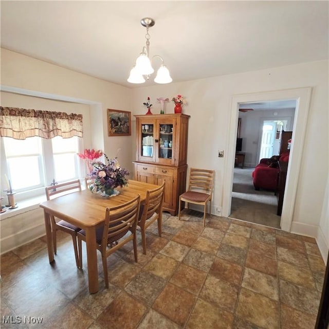 3303 Hemlock St, Parkersburg, WV 26101 - dining room with a chandelier and dark stone finish floors
