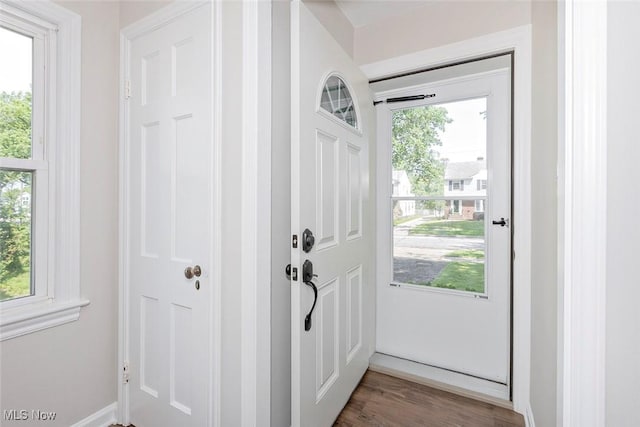 4030 Silsby Rd, University Heights, OH 44118 - doorway to outside featuring healthy amount of natural light and wood finished floors