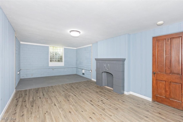 4030 Silsby Rd, University Heights, OH 44118 - unfurnished living room featuring wood finished floors and baseboards