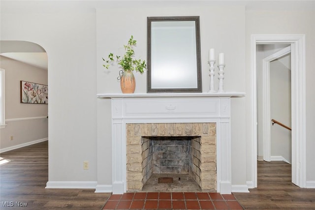 4030 Silsby Rd, University Heights, OH 44118 - detailed view of wood finished floors, a fireplace with flush hearth, and arched walkways
