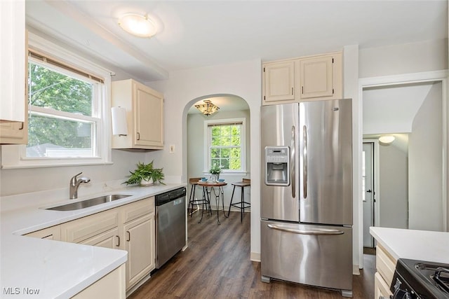 4030 Silsby Rd, University Heights, OH 44118 - kitchen featuring appliances with stainless steel finishes, light countertops, and arched walkways