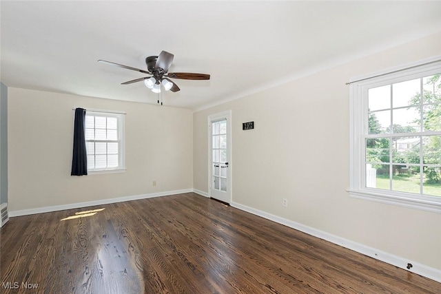 4030 Silsby Rd, University Heights, OH 44118 - empty room featuring healthy amount of natural light, dark wood-style flooring, and ceiling fan