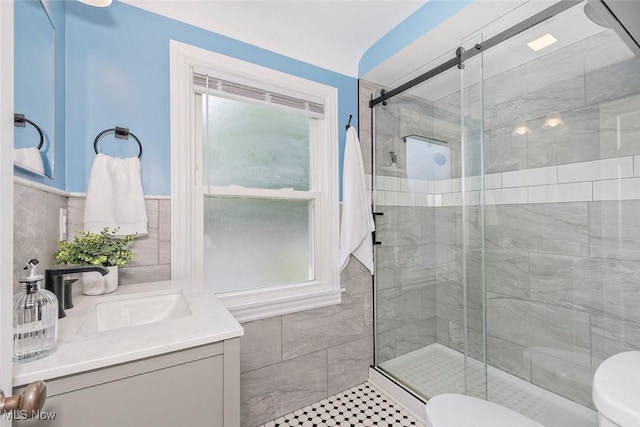 4030 Silsby Rd, University Heights, OH 44118 - full bath with a stall shower, vanity, and tile walls
