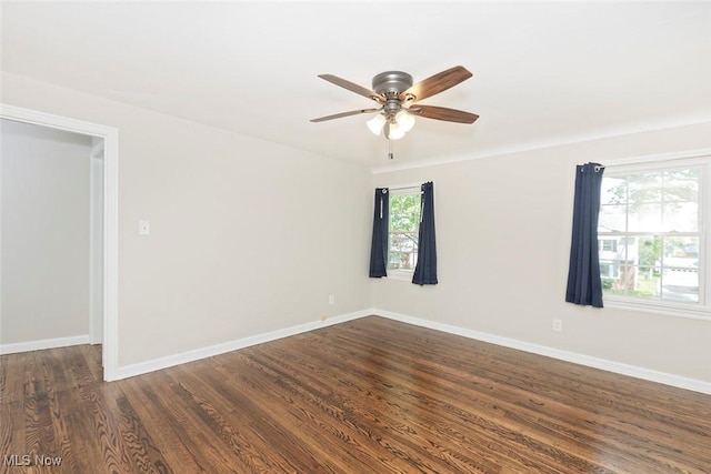 4030 Silsby Rd, University Heights, OH 44118 - spare room featuring a ceiling fan and dark wood-style flooring