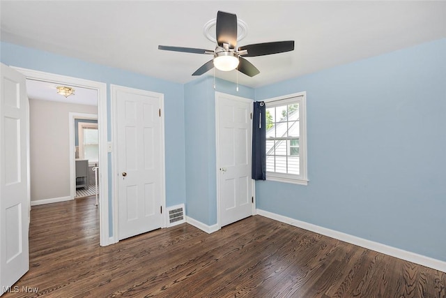 4030 Silsby Rd, University Heights, OH 44118 - unfurnished bedroom with dark wood-type flooring and ceiling fan