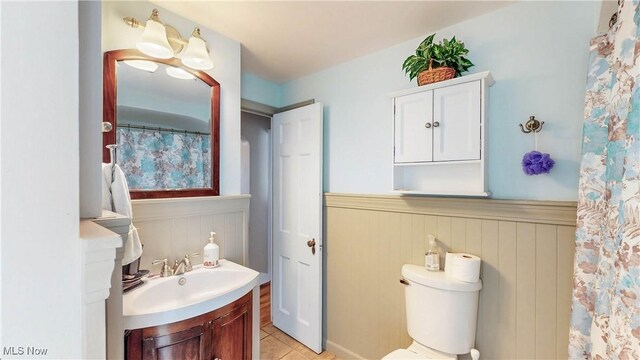 3622 Northcliffe Rd, University Heights, OH 44118 - bathroom featuring vanity, wainscoting, and tile patterned flooring