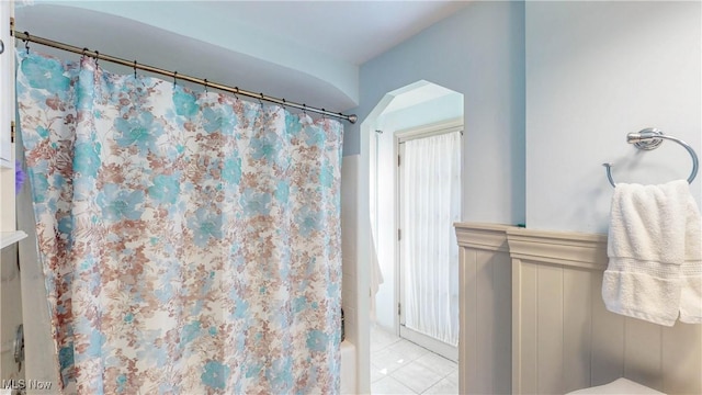 3622 Northcliffe Rd, University Heights, OH 44118 - full bath with tile patterned flooring, shower / bath combo with shower curtain, and a wainscoted wall
