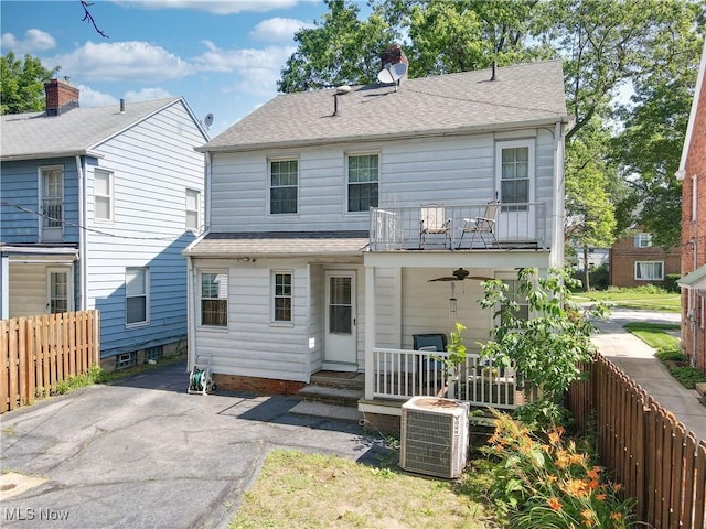 3622 Northcliffe Rd, University Heights, OH 44118 - rear view of house with roof with shingles, a balcony, a chimney, and a patio