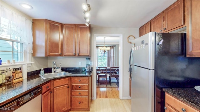 3622 Northcliffe Rd, University Heights, OH 44118 - kitchen featuring dishwasher, freestanding refrigerator, healthy amount of natural light, and brown cabinetry