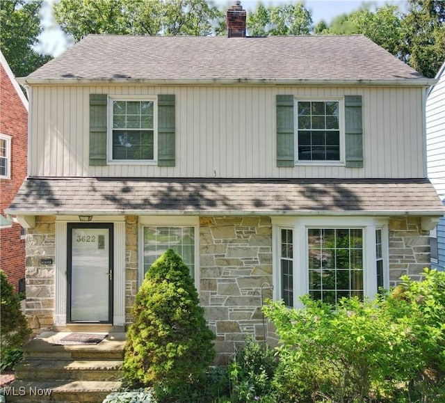 3622 Northcliffe Rd, University Heights, OH 44118 - view of front of house featuring stone siding, a chimney, and a shingled roof