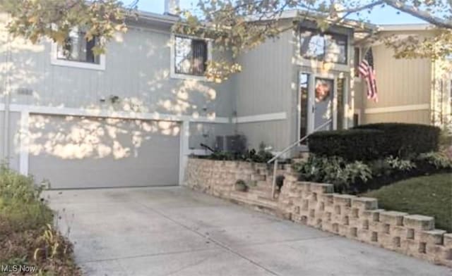 7135 N Holmes Pl, Concord, OH 44077 - view of home's exterior featuring driveway and a garage