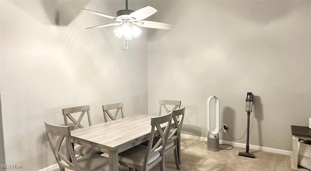 7135 N Holmes Pl, Concord, OH 44077 - carpeted dining room with a ceiling fan and baseboards