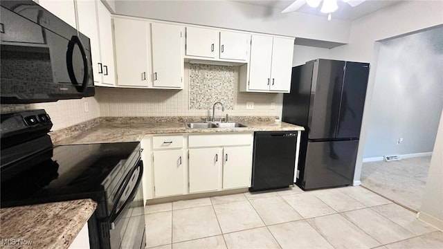 7135 N Holmes Pl, Concord, OH 44077 - kitchen with black appliances, tasteful backsplash, ceiling fan, white cabinetry, and light tile patterned floors