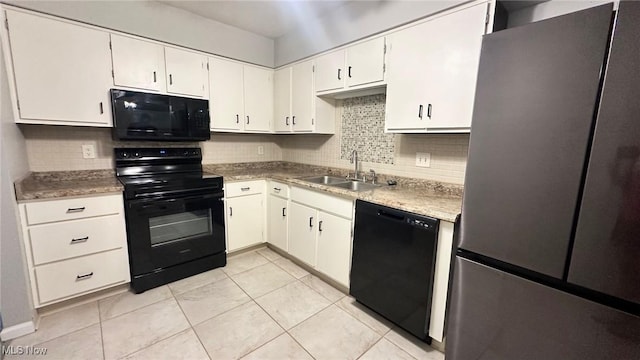 7135 N Holmes Pl, Concord, OH 44077 - kitchen featuring black appliances, tasteful backsplash, light tile patterned floors, white cabinets, and light countertops