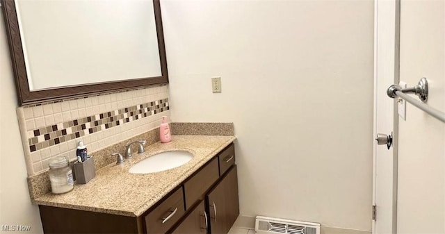 7135 N Holmes Pl, Concord, OH 44077 - bathroom with decorative backsplash and vanity
