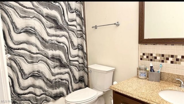 7135 N Holmes Pl, Concord, OH 44077 - bathroom featuring tasteful backsplash, vanity, and a shower with shower curtain