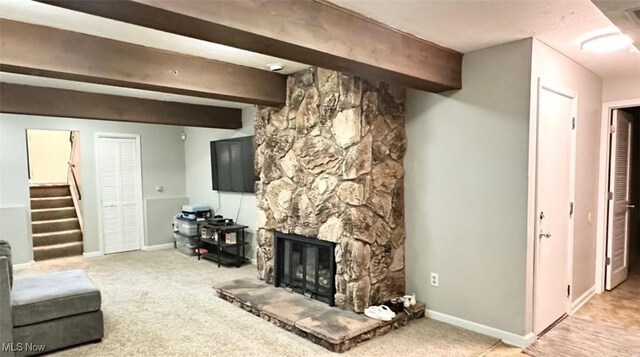 7135 N Holmes Pl, Concord, OH 44077 - living room with stairway, beam ceiling, light carpet, and a stone fireplace