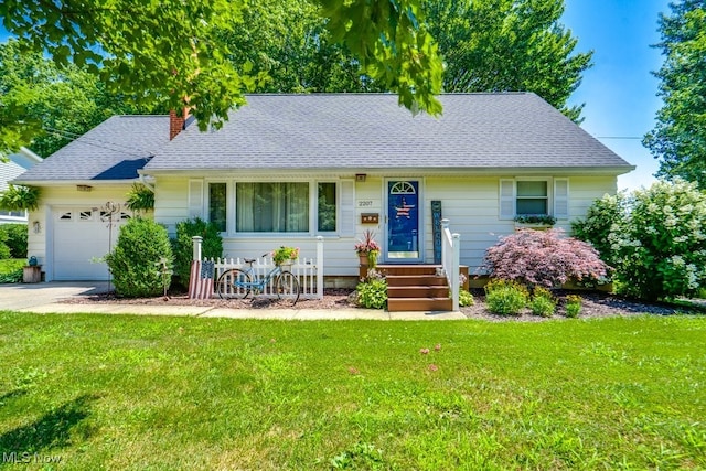 2207 Robinhood Dr, Wooster, OH 44691 - view of front of house with an attached garage, a front yard, roof with shingles, and a chimney
